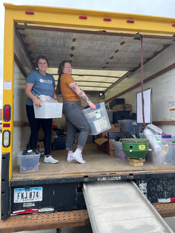 TTMT employees unloading items from a truck