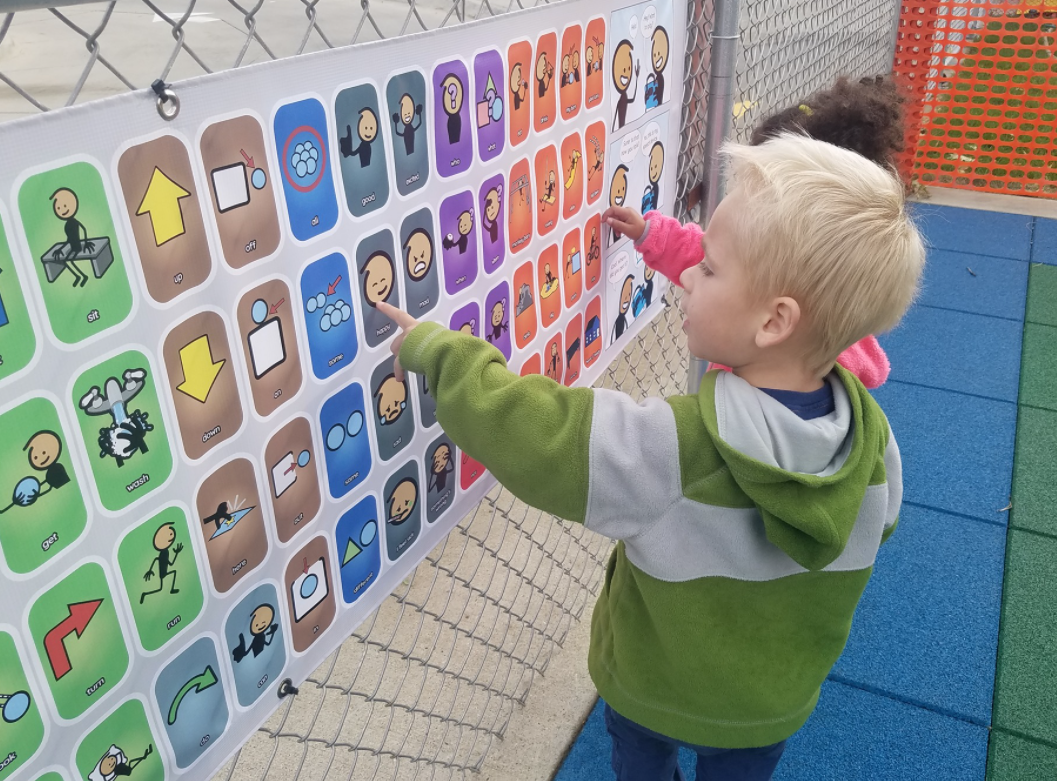 Child using communication board
